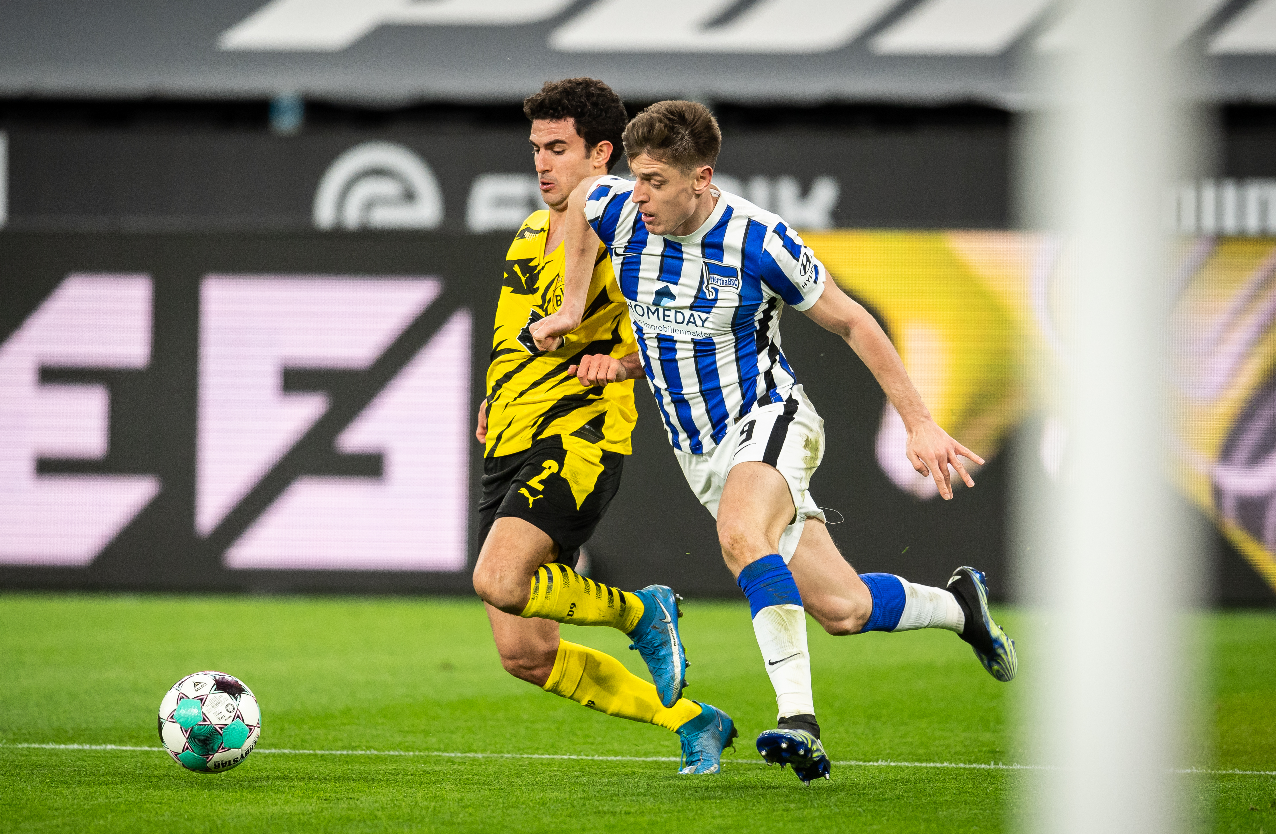 Piatek wrestles for the ball against Borussia Dortmund