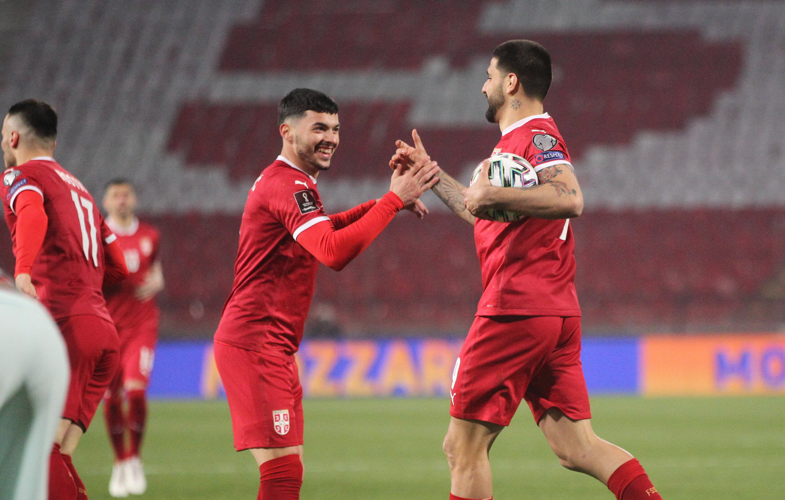 Nemanja Radonjić and  Aleksandar Mitrović celebrate a goal.