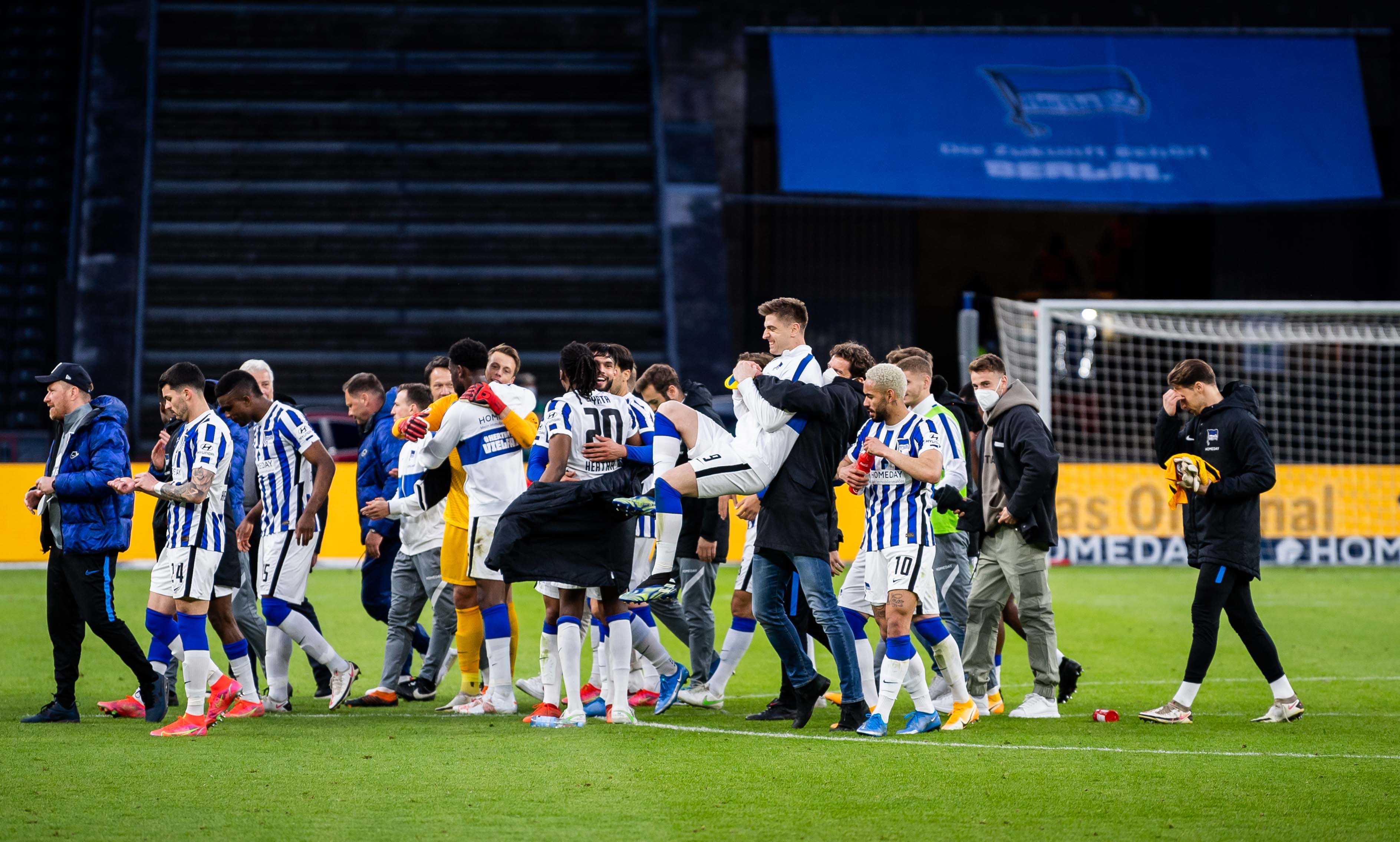 The lads celebrate together after the final whistle.