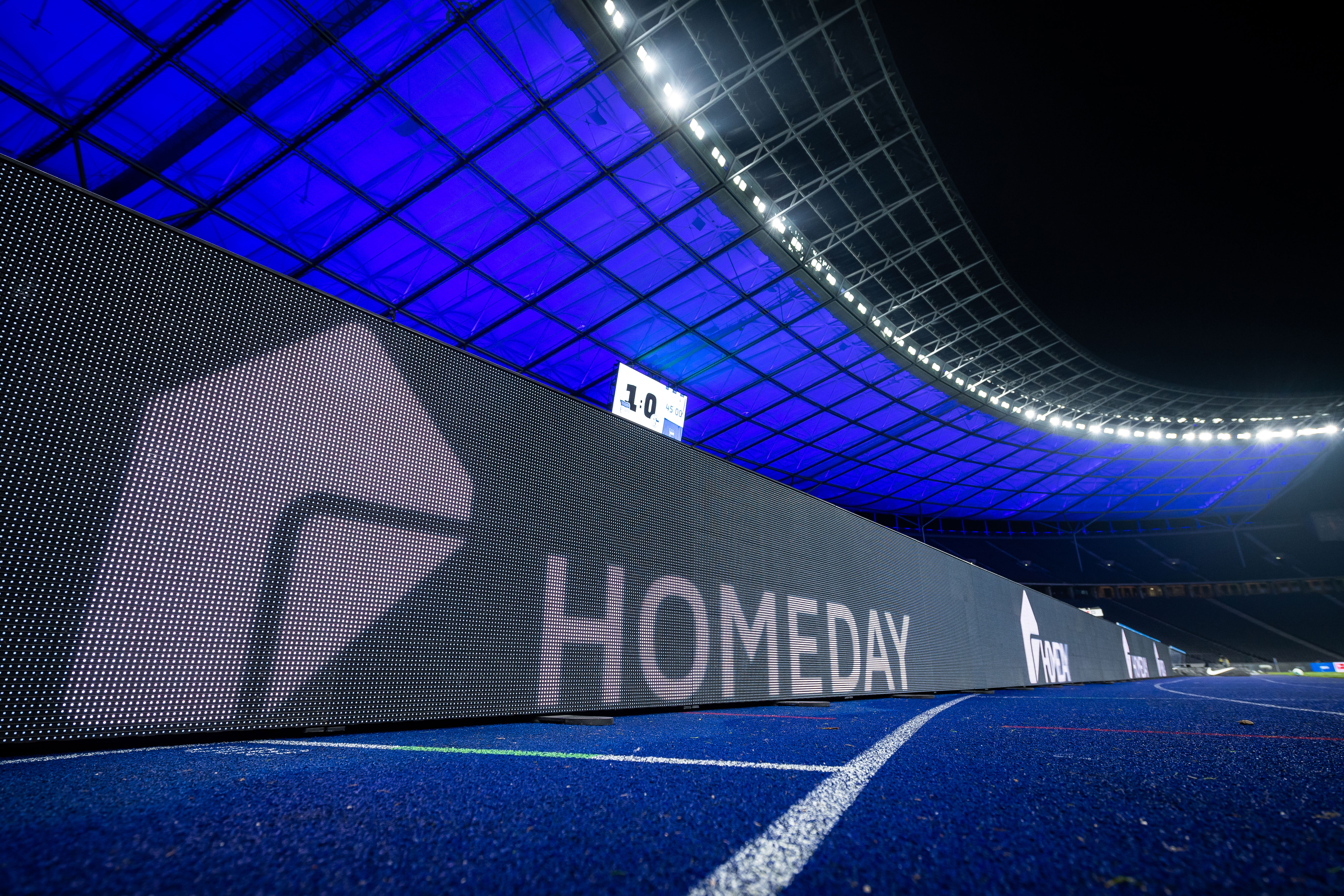 Homeday's logo on the advertising board at the Olympiastadion.