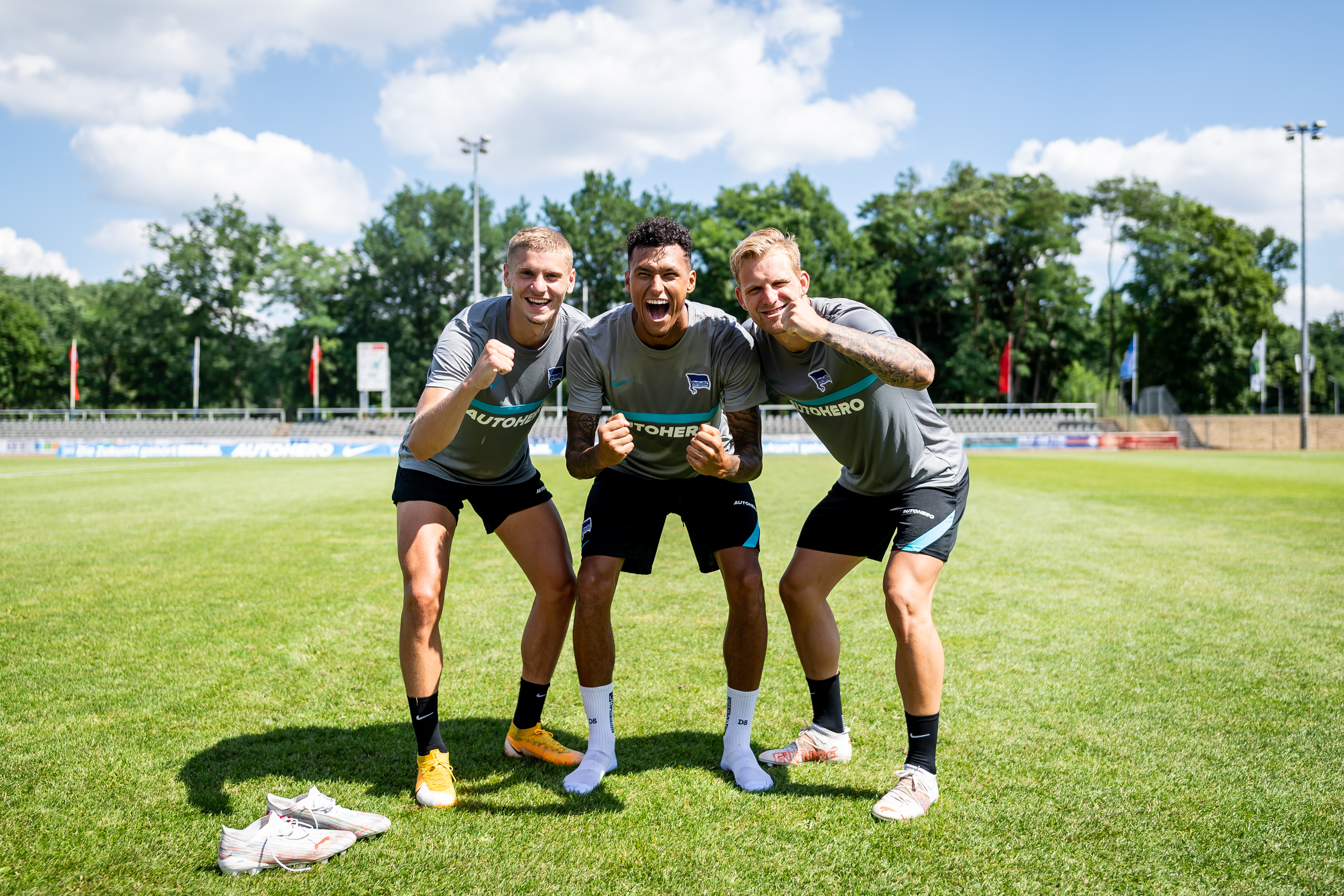 Márton Dárdai, Davie Selke and Arne Maier celebrate at training.