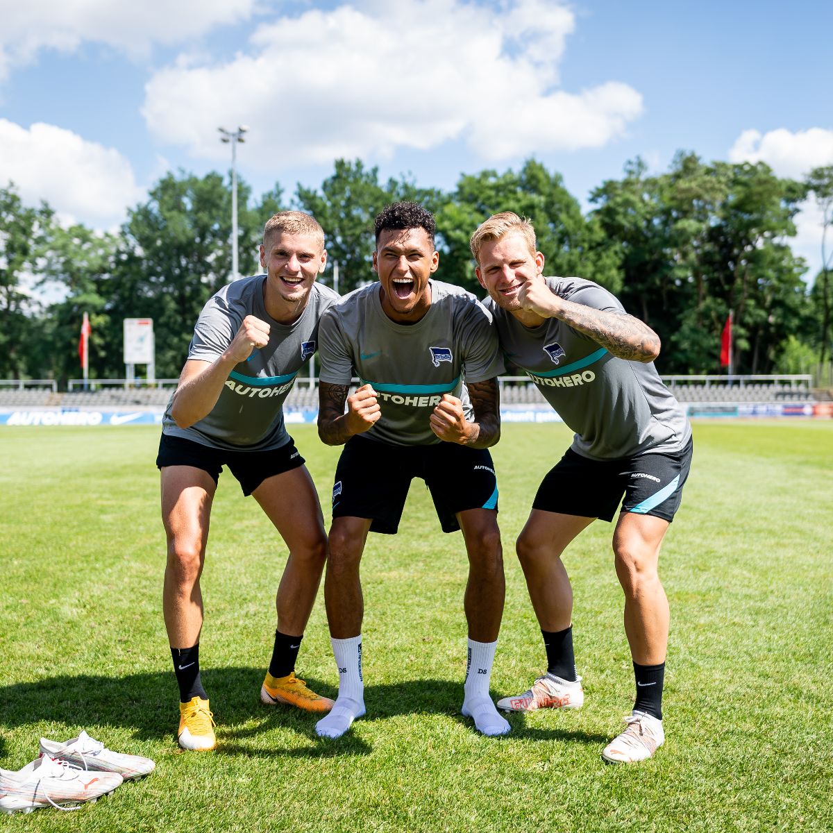Márton Dárdai, Davie Selke and Arne Maier celebrate at training.