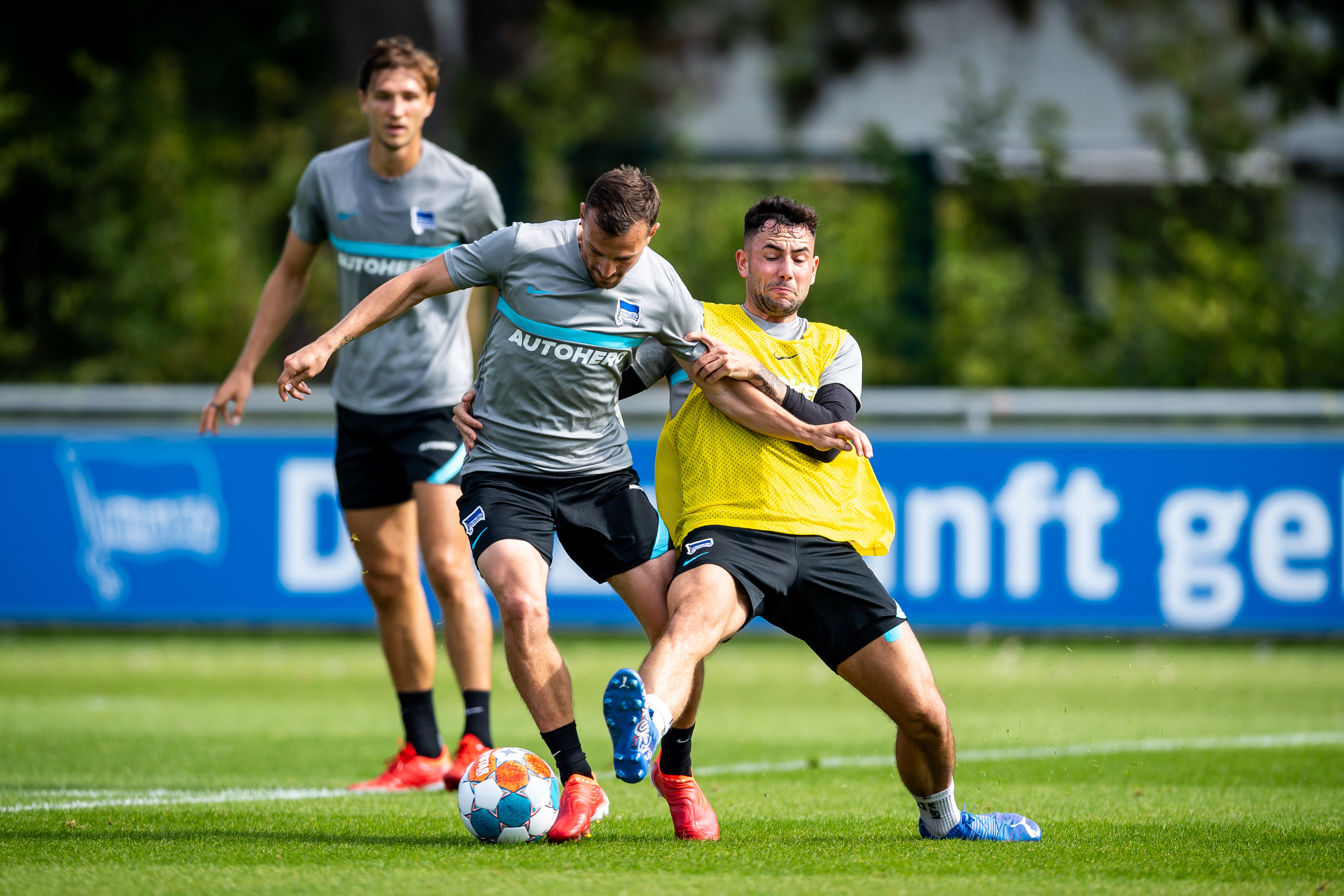 Vladimír Darida and Marco Richter challenge for the ball.