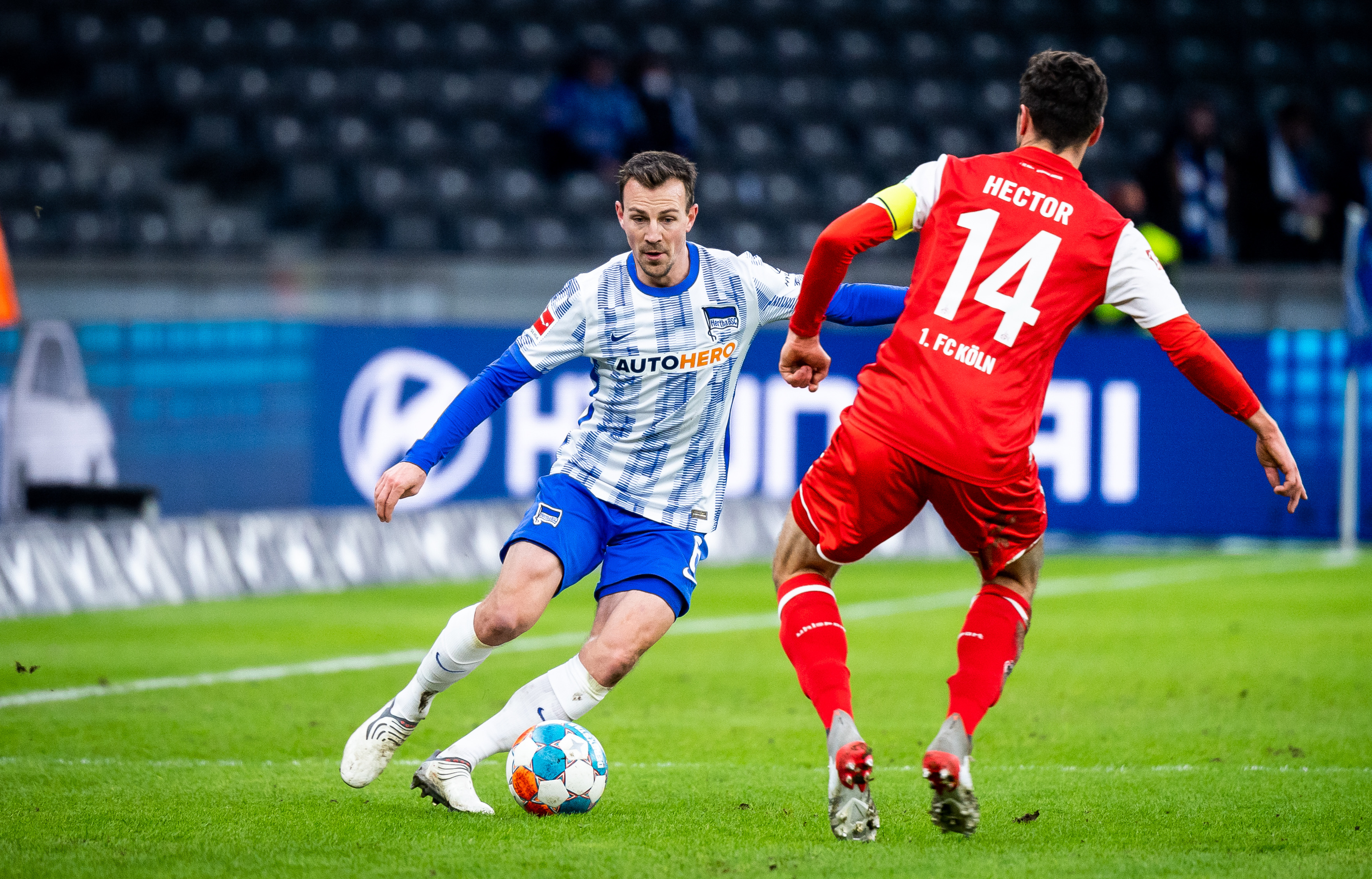 Vladimír Darida on the ball, under pressure from Jonas Hector.