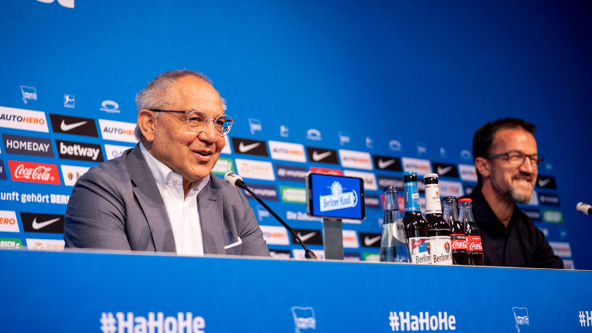 Felix Magath and Fredi Bobic sit at the podium.