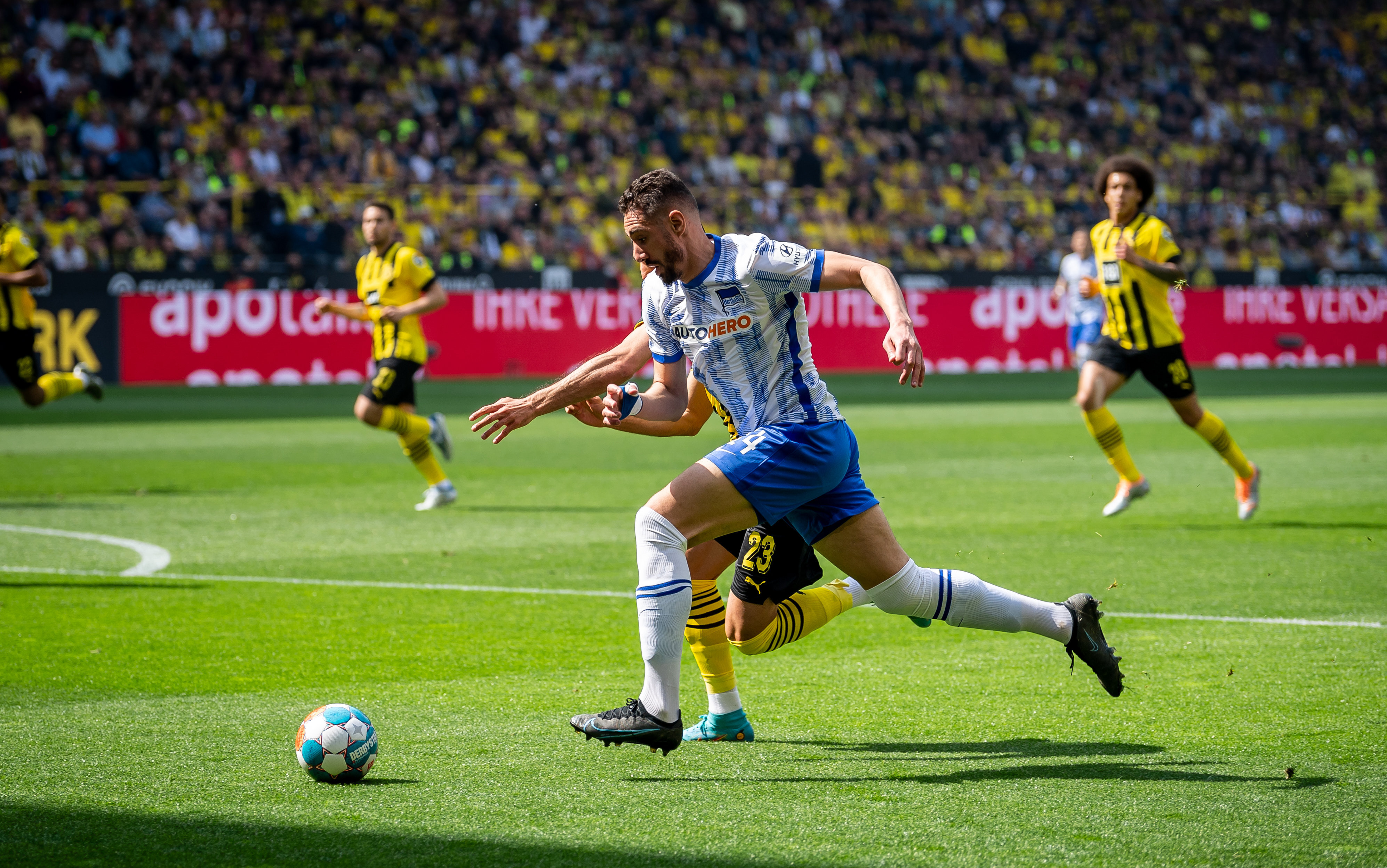 Ishak Belfodil looks to get past Emre Can.