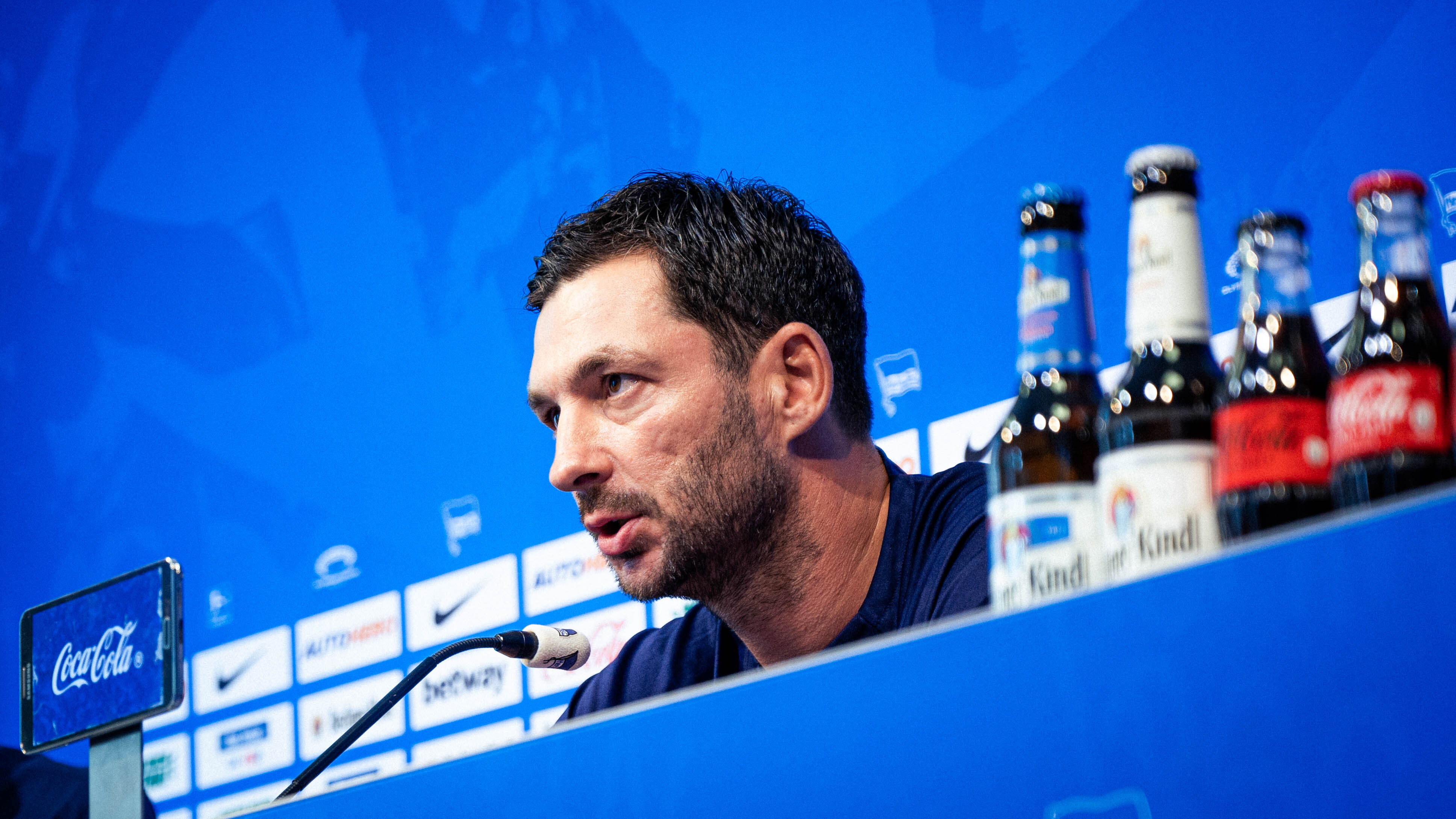 Sandro Schwarz speaking at a press conference