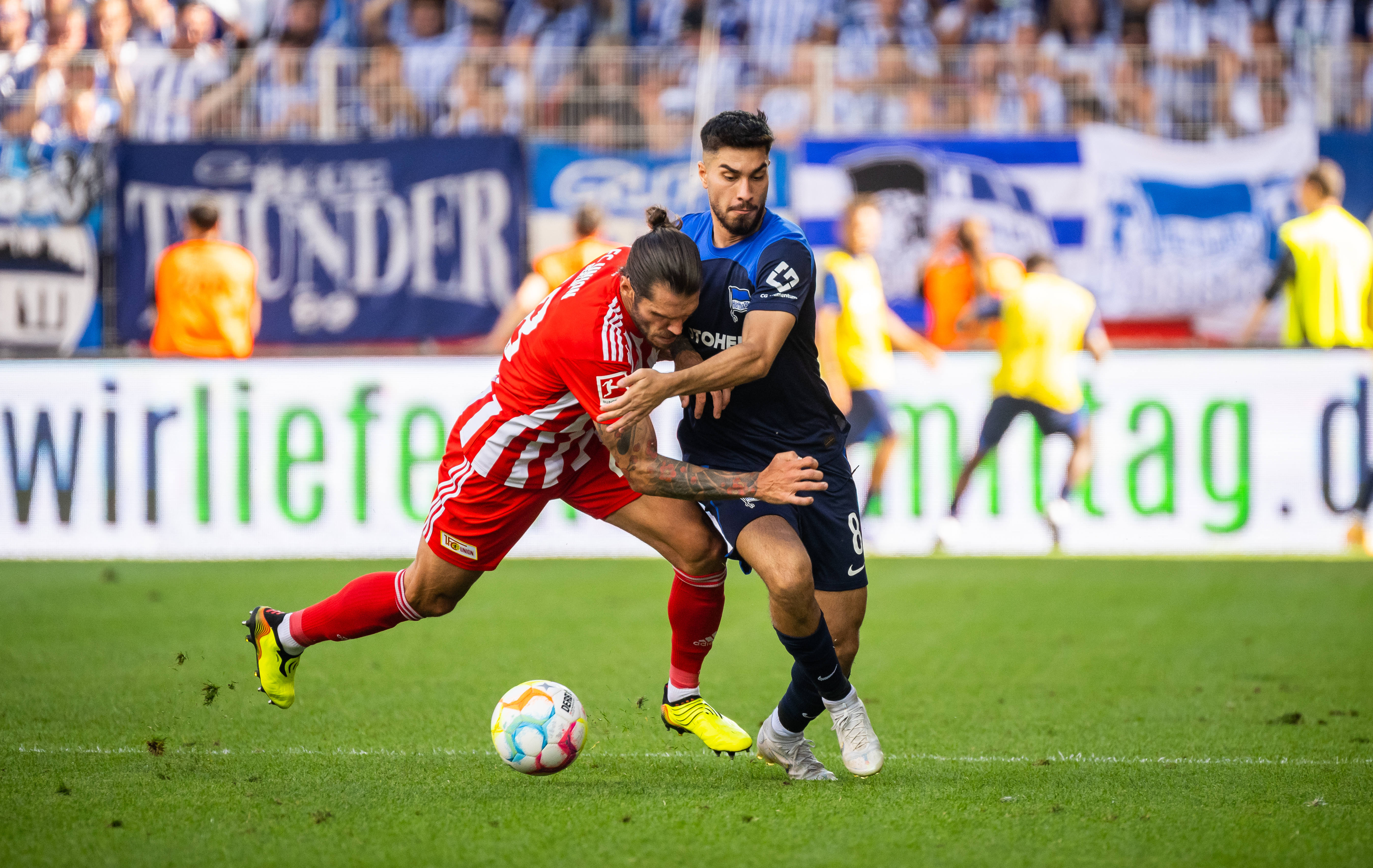 Suat Serdar competes for the ball with Christopher Trimmel.