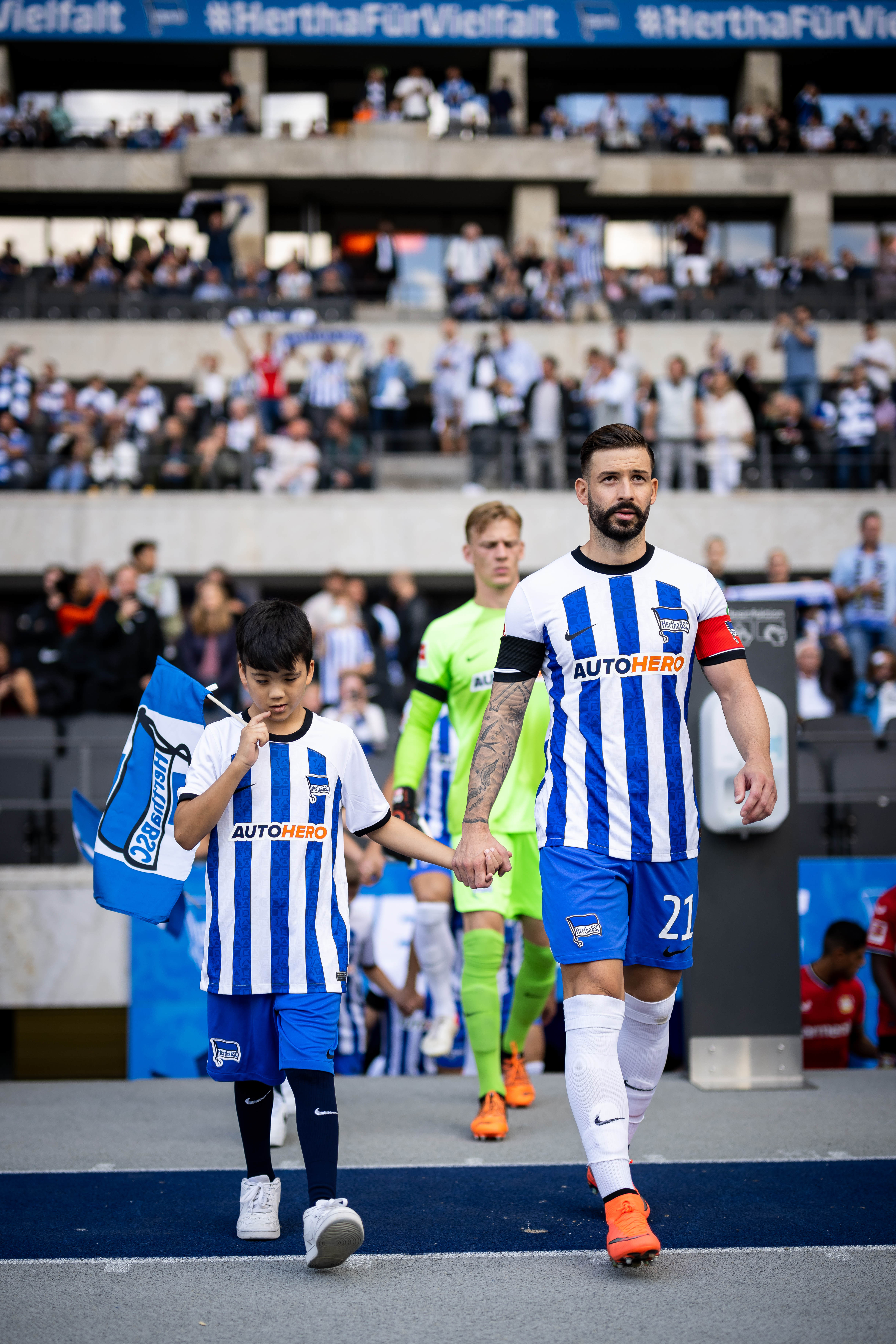 Marvin Plattenhardt leads Hertha out as captain at the Olympiastadion.
