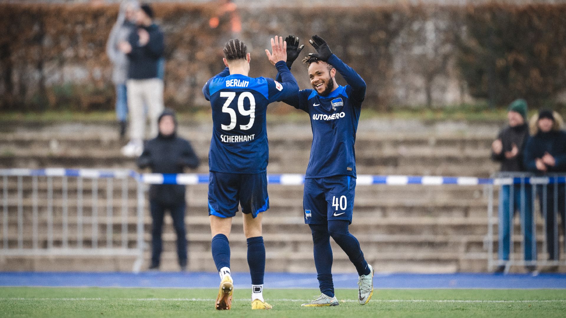 Chidera Ejuke and Derry Scherhant celebrate the goal.