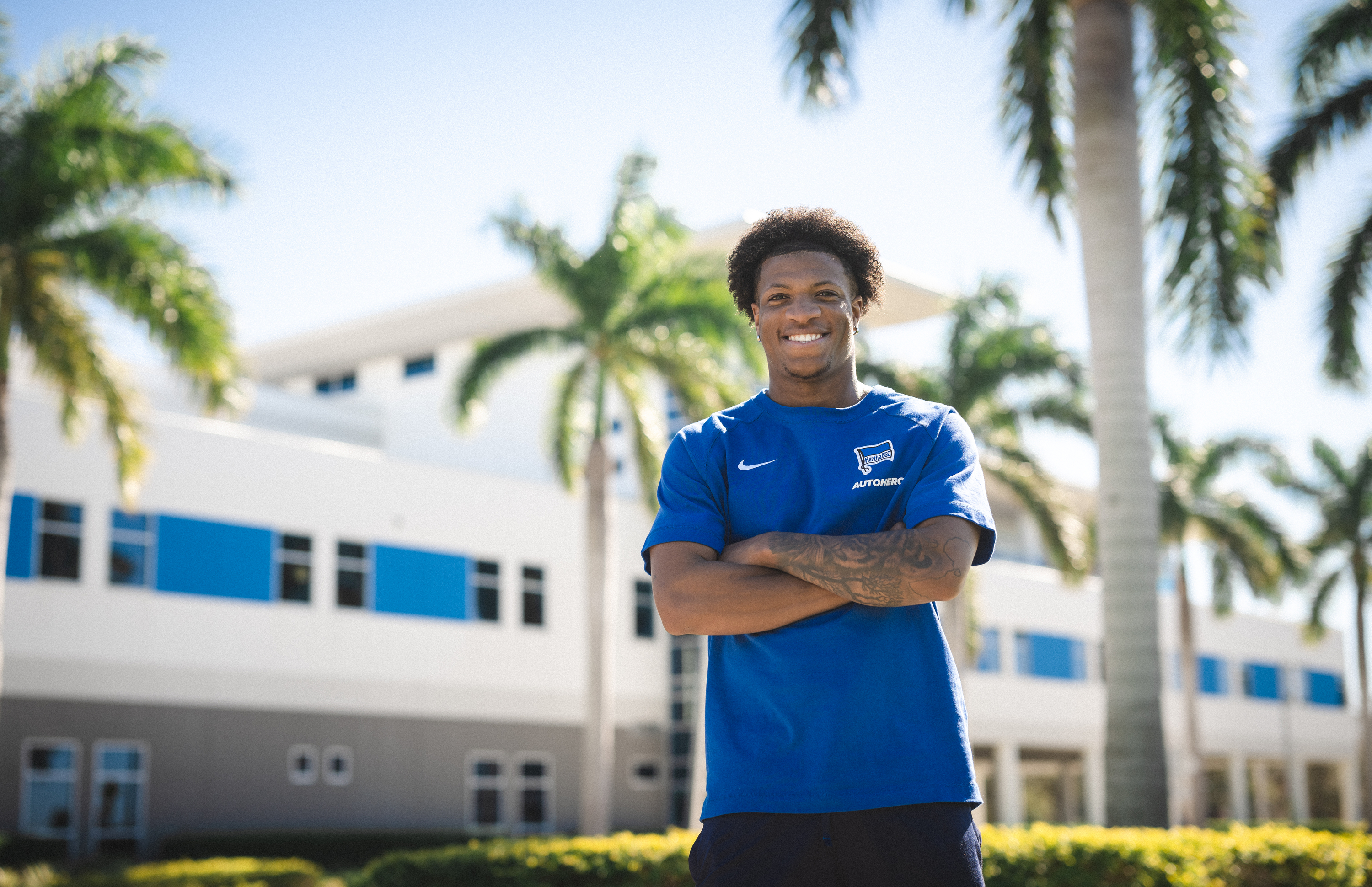 Jessic Ngankam smiles for the camera, outside the IMG Academy in Florida.