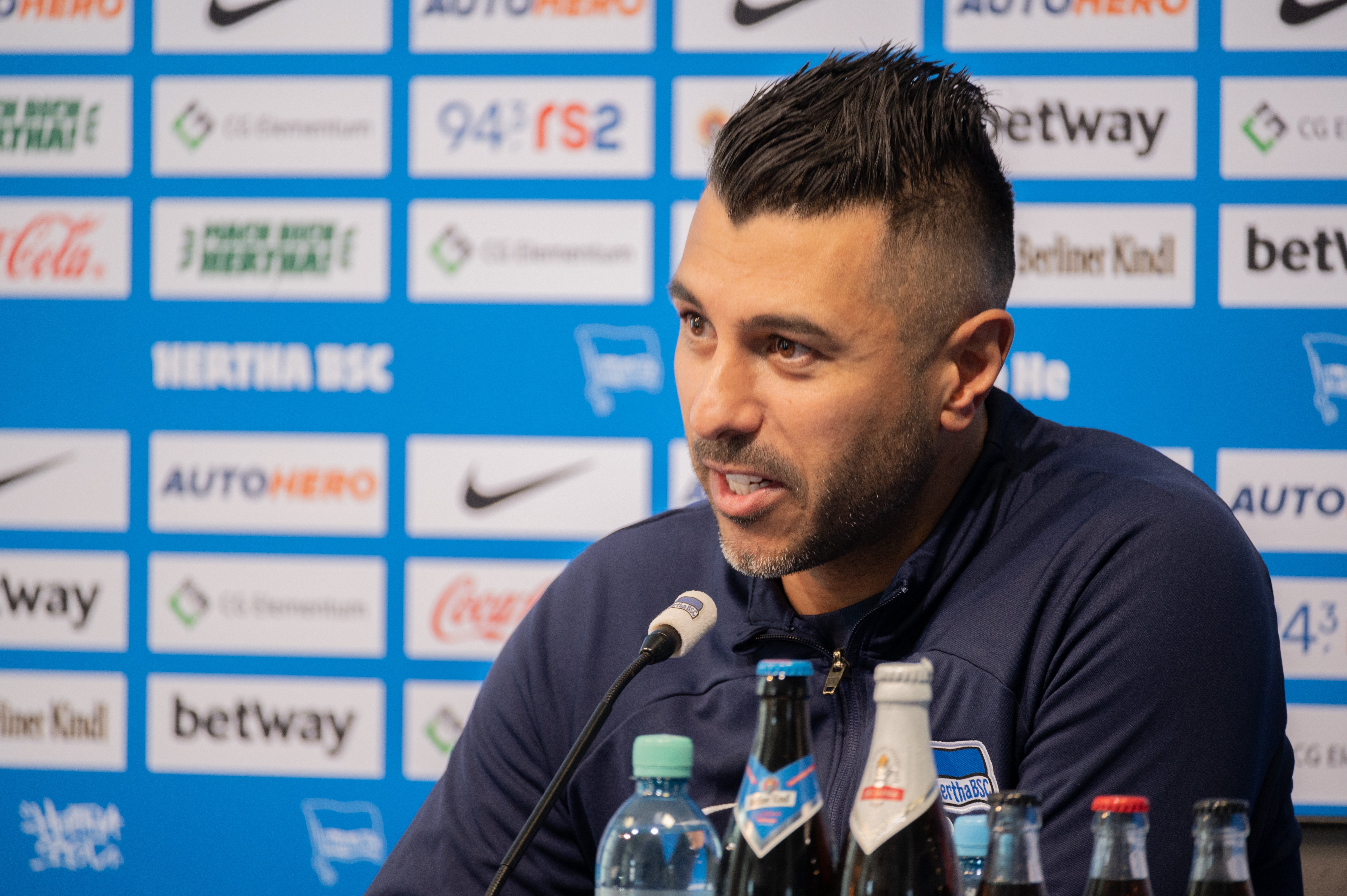 Volkan Bulut speaks to the media at the press conference.
