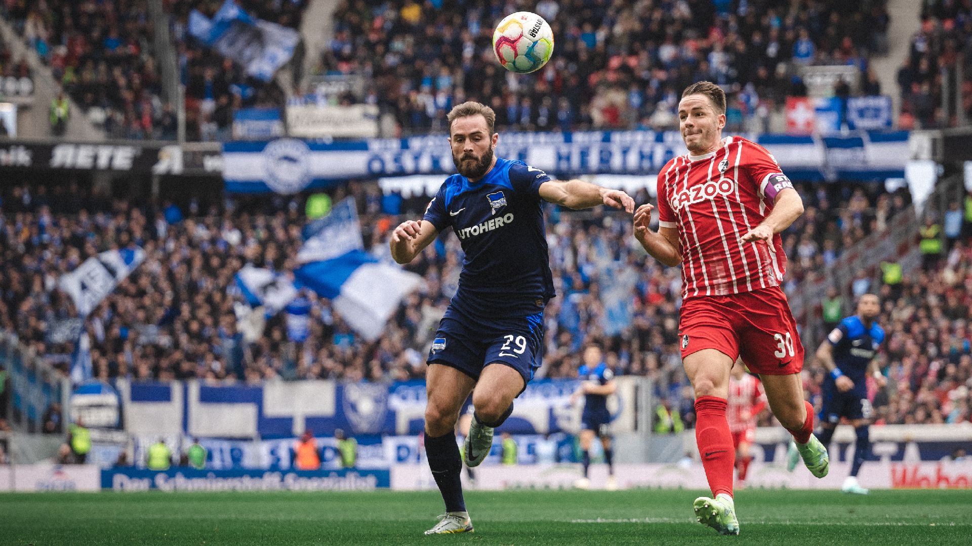 Lucas Tousart competes for the ball.