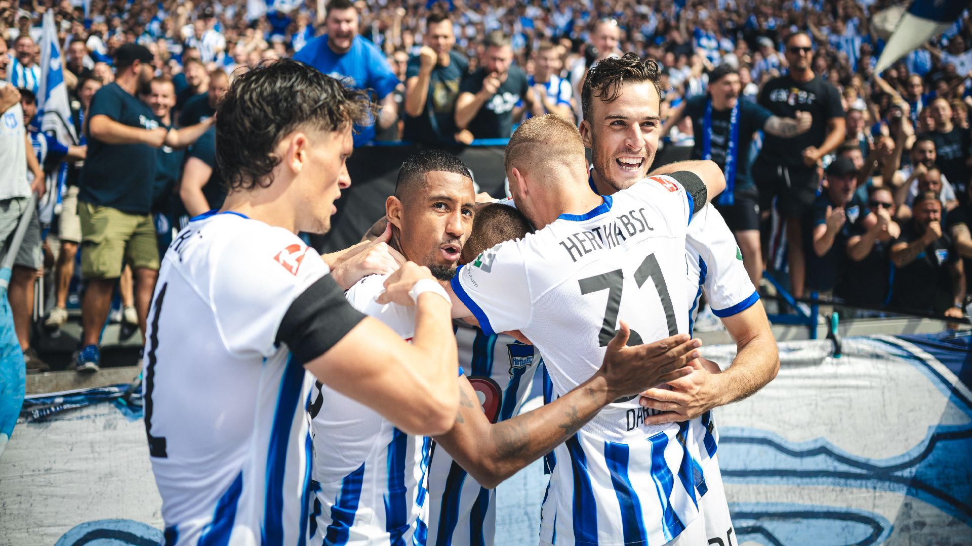 The players celebrate our third goal.