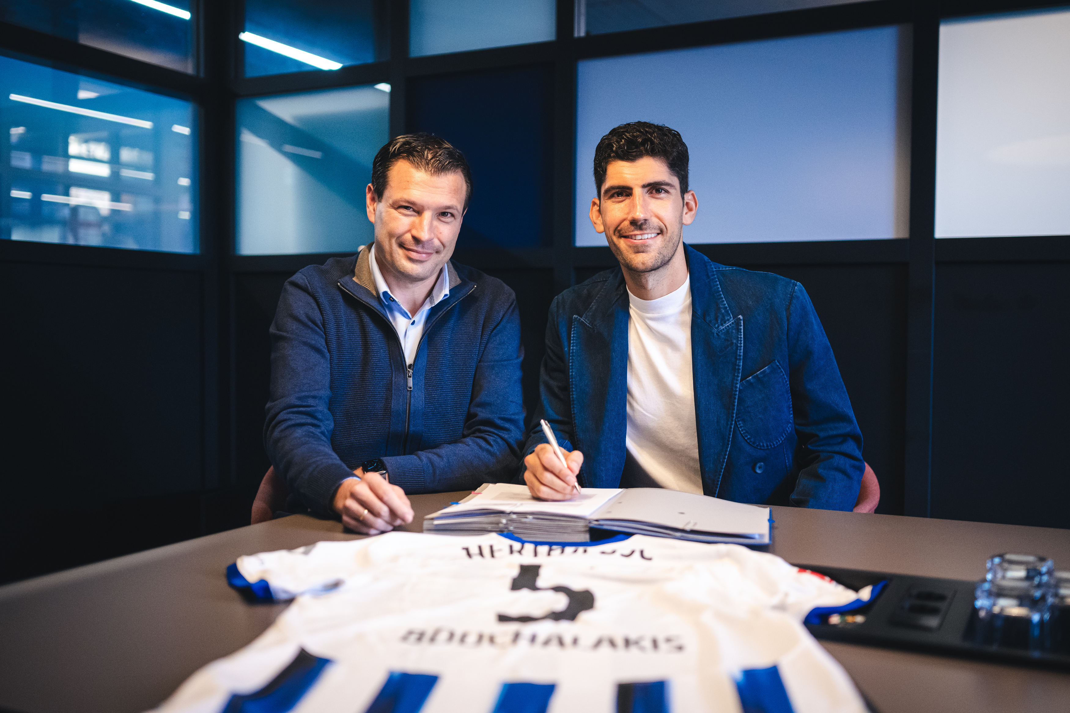 Benjamin Weber and Andreas Bouchalakis at the midfielder's contract signing