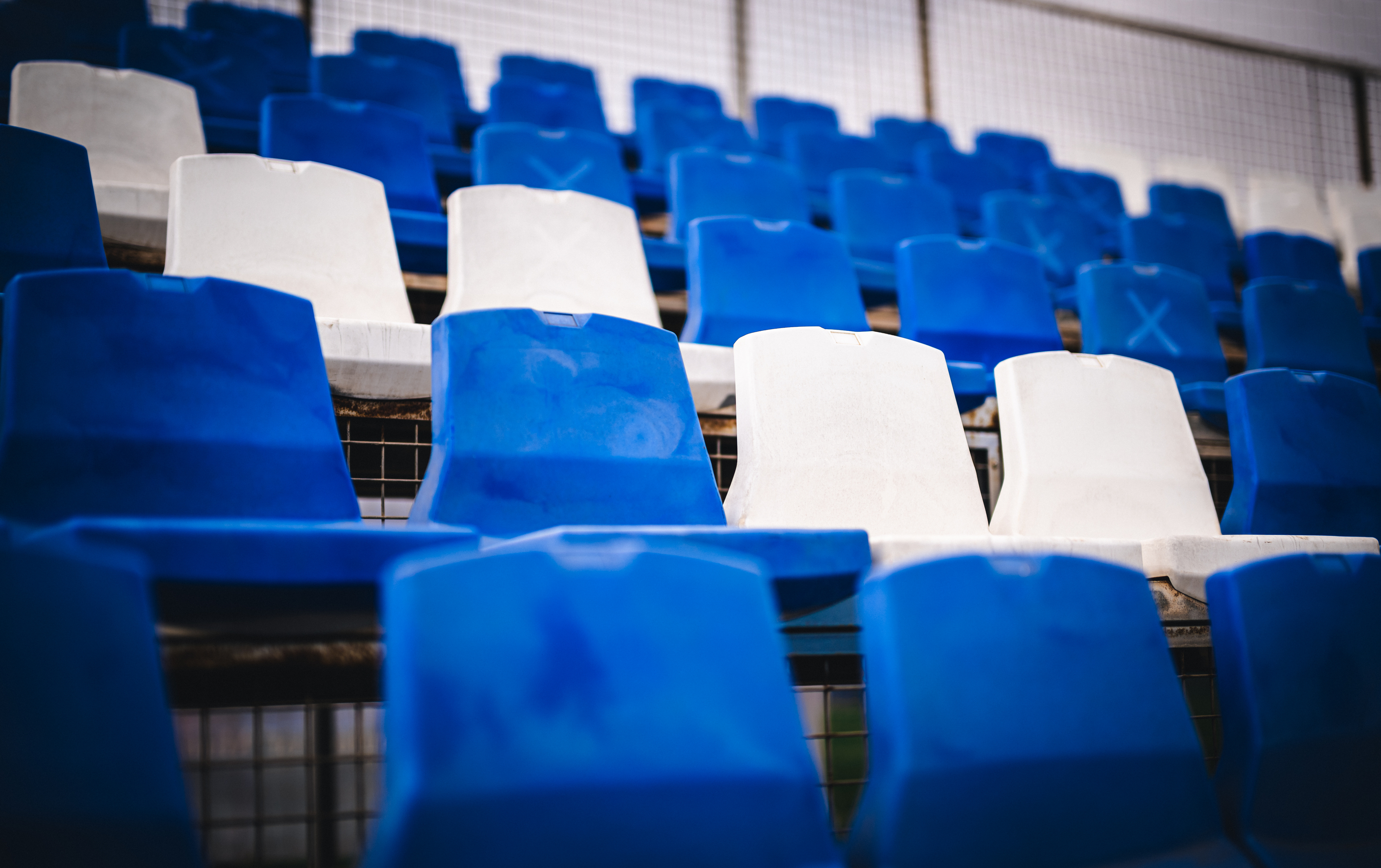 The blue and white stadium seats.